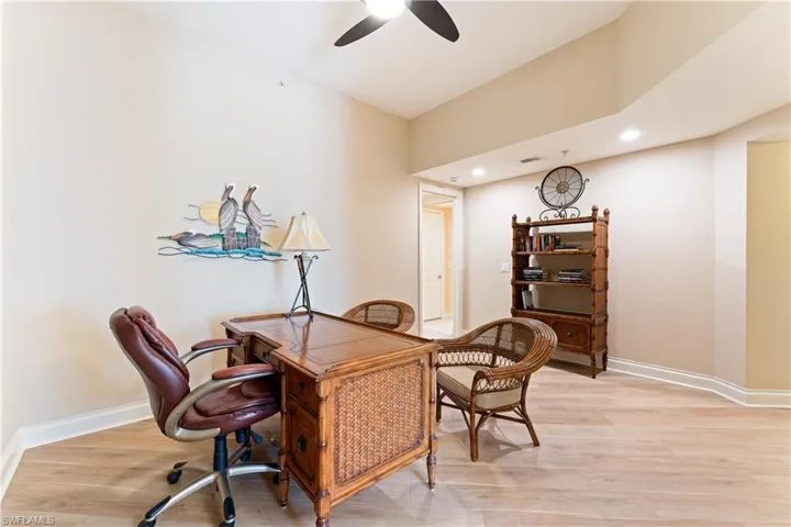 Office space featuring recessed lighting, light wood-style flooring, and a ceiling fan
