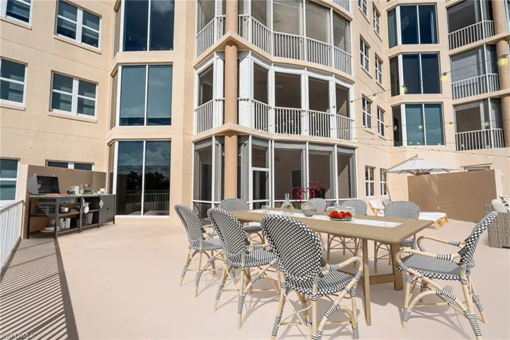 Private 2000 sq ft Patio / Terrace  sunroom, outdoor dining area, and a patio