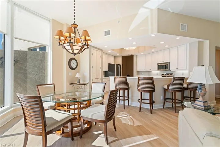 Dining room with a chandelier and light wood-type flooring