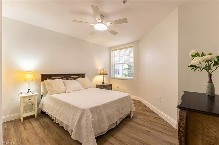 Bedroom with wood finished floors and a ceiling fan