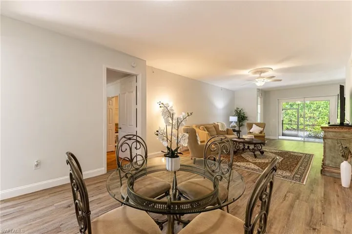 Dining space with light wood finished floors and a ceiling fan