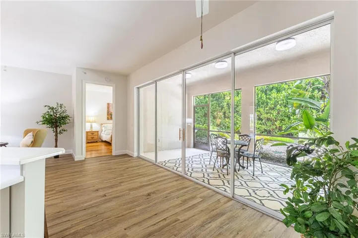 Dining space with light wood-style flooring and ceiling fan