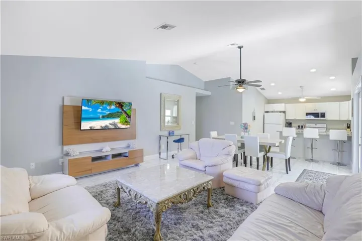Living area featuring ceiling fan