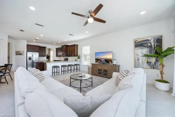 Tiled living room with ceiling fan