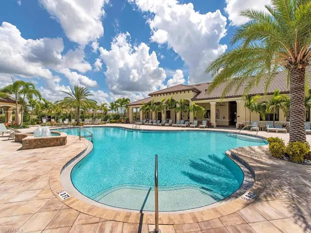 Community pool featuring a patio