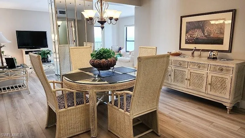 Dining room with a chandelier and light wood finished floors