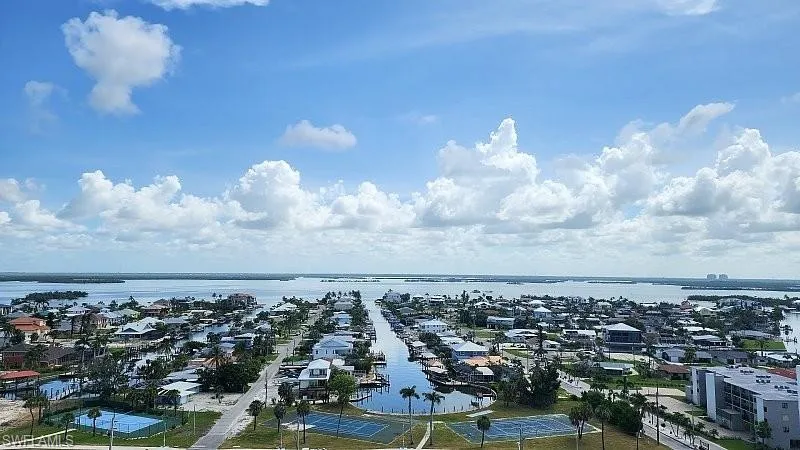 Aerial view of residential area with a nearby body of water