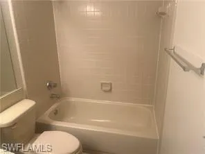Full bath with bathtub / shower combination and toilet