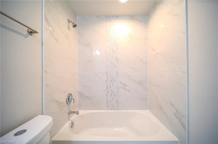 The Spare Bathroom Has Granite Countertops And Custom Accent Tile Over The Tub Area!