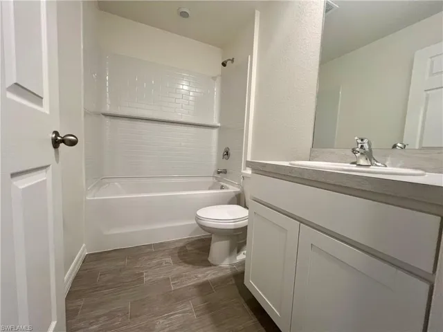 Bathroom featuring vanity and bathing tub / shower combination