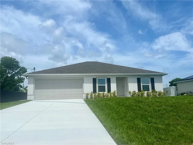 Single story home with stucco siding, driveway, a garage, and roof with shingles