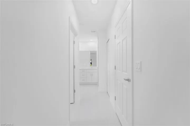 Hallway featuring baseboards