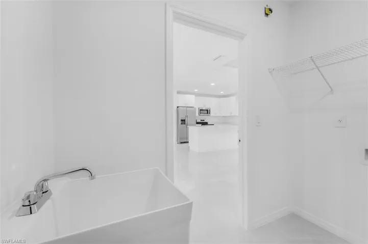 Bathroom with a freestanding bath and a walk in closet