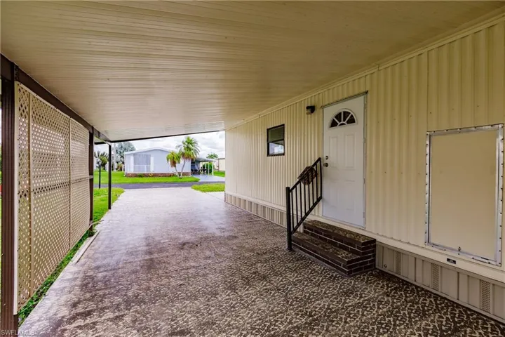 View of patio with a carport