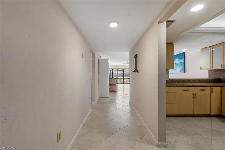 Corridor with light tile flooring