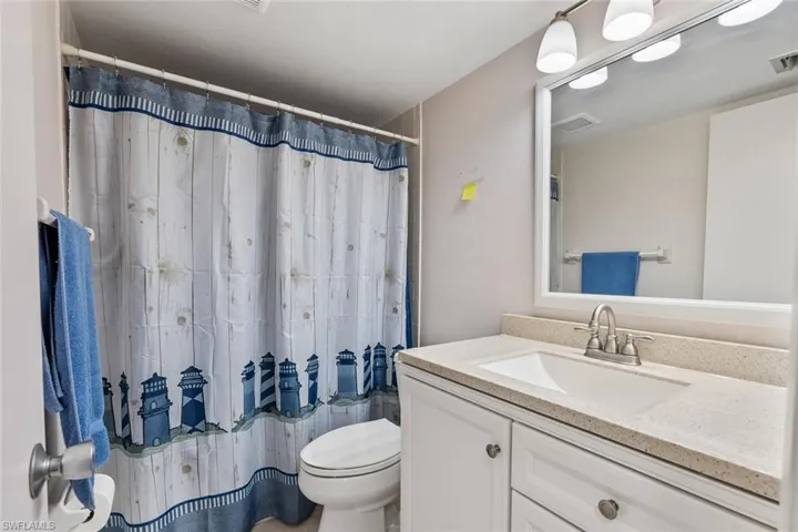 Bathroom featuring oversized vanity and toilet
