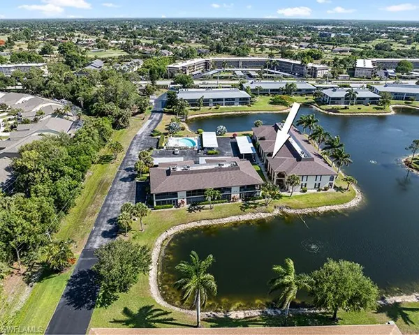 Birds eye view of property featuring a water view