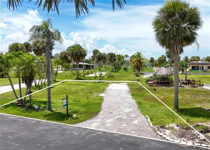 View of property's community featuring a lawn