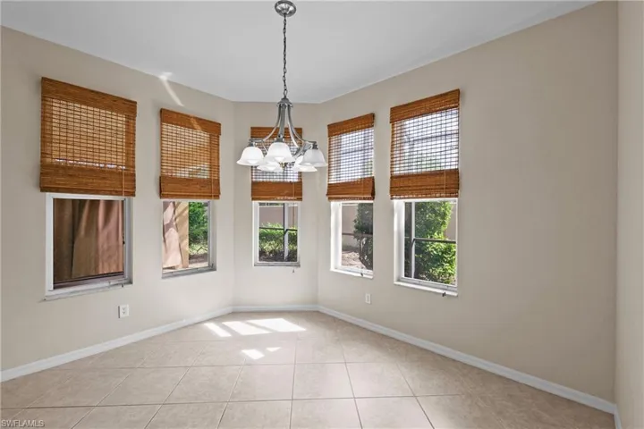 Large Breakfast dining area featuring a chandelier and light tile patterned floors
