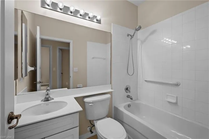 Full bath featuring bathing tub / shower combination and vanity