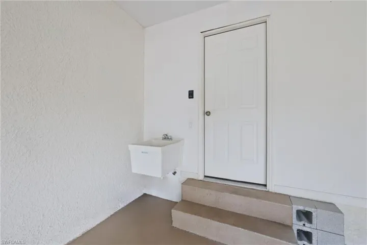 Garage with a laundry sink.  Garage Service Door