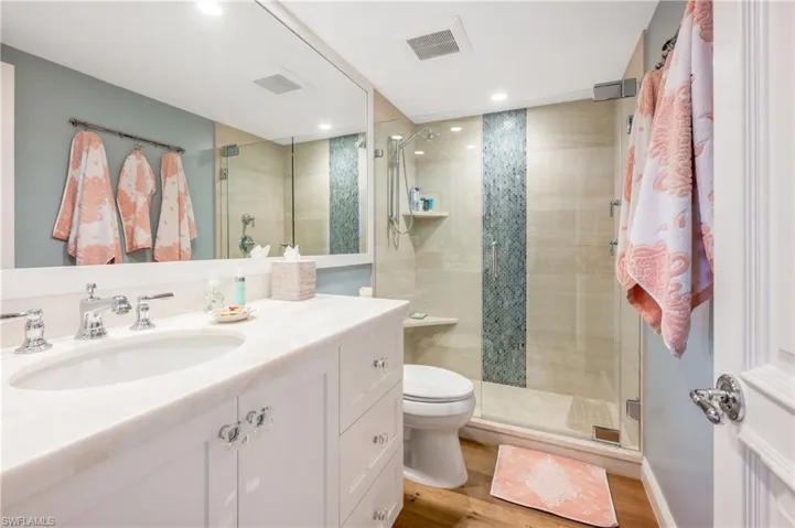 The guest bath has been updated and offers a spacious shower.