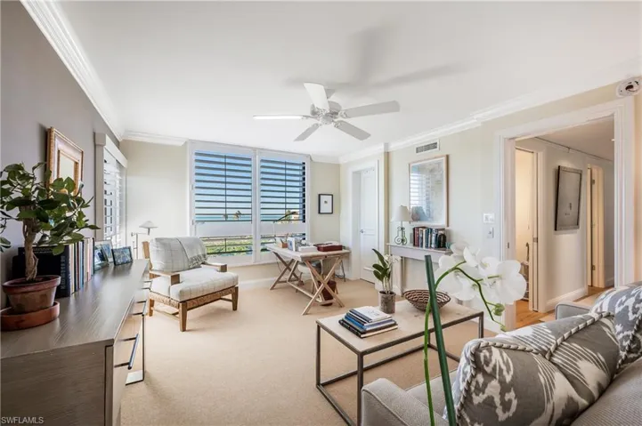 This is currently used as an office and could be a bedroom with a deep closet, paddle fan, shutters and molding.  A very pretty room with wonderful views.