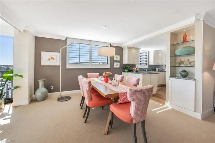 Enjoying dinners in this light filled space is a prescription to build memories.  Enhanced by shutters and pretty built-ins.