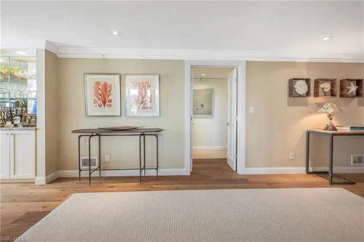 This area connects beautifully with the living room, kitchen and the two bedroom wing.  Attractive built in offers storage space.