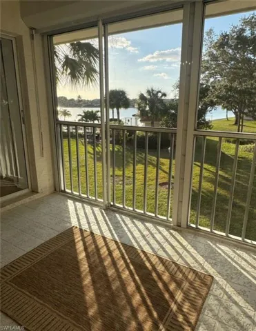 Unfurnished sunroom with a water view