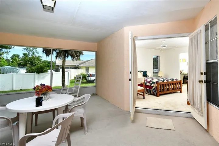 Back porch leads to primary bedroom.