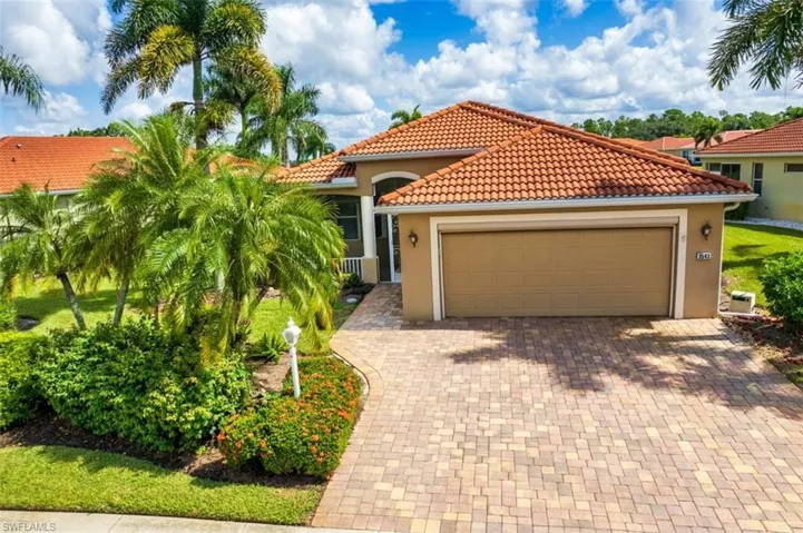 Mediterranean / spanish-style home featuring a garage