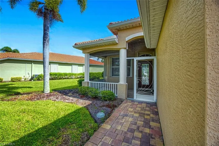Property entrance with a yard