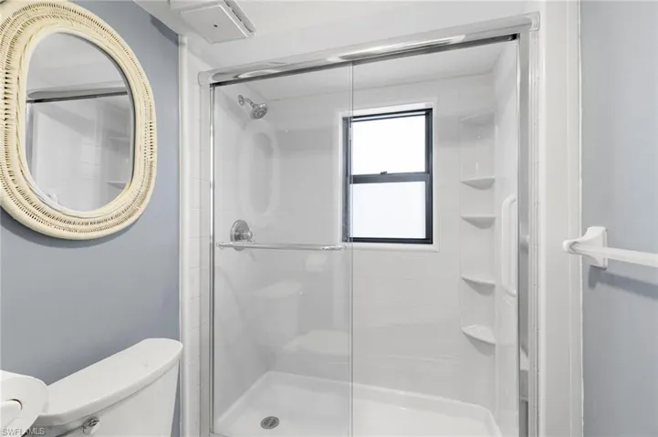 Full bathroom with a stall shower