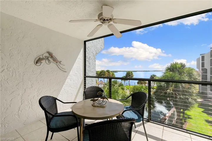 Balcony with ceiling fan and a sunroom