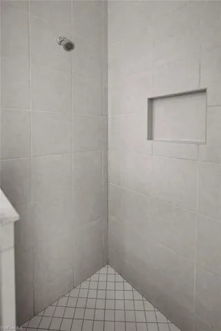 Bathroom with a tile shower
