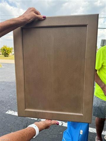 Bottom kitchen cabinets brown showing, top white
