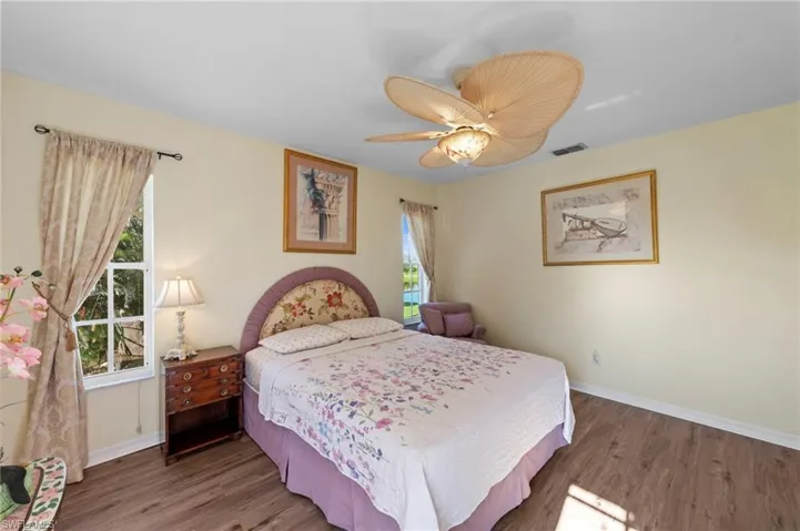 Bedroom featuring wood finished floors and a ceiling fan