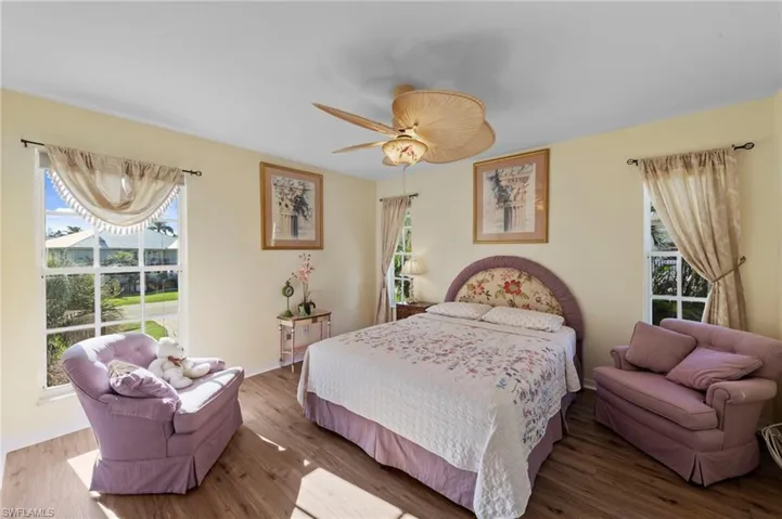 Bedroom featuring wood finished floors and ceiling fan