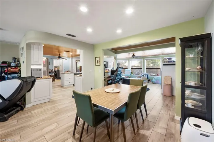 Dining space with recessed lighting, visible vents, a ceiling fan, and light wood-style flooring