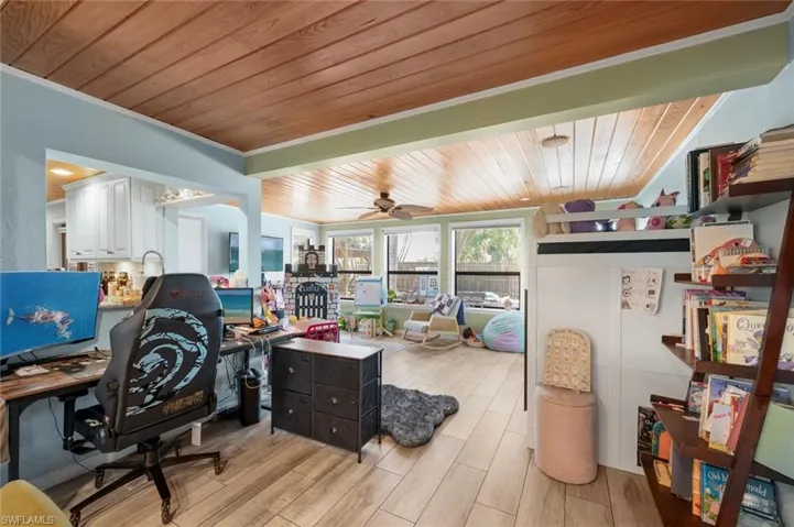 Office area featuring wood ceiling, light wood finished floors, and ceiling fan