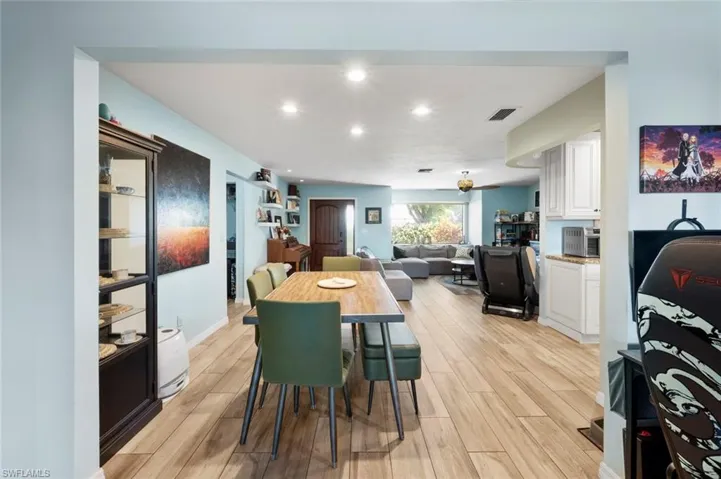 Dining space featuring visible vents, recessed lighting, and light wood-style floors