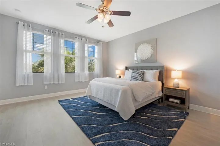 Sun-filled master bedroom with LVP flooring