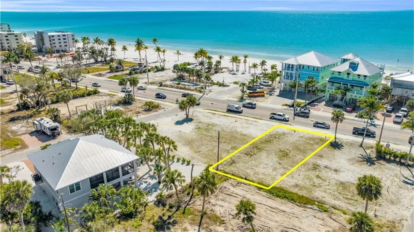 Birds eye view of property with a water view and a beach view VIRTUALLY EDITED