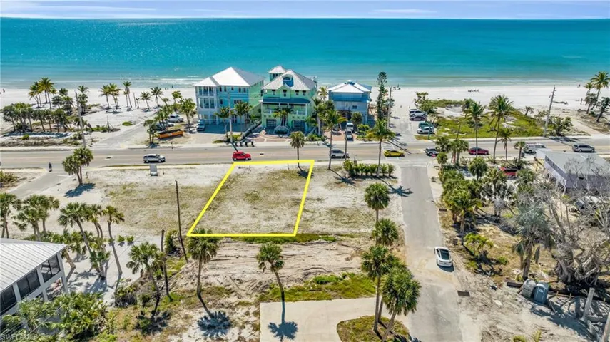 Birds eye view of property featuring a beach view and a water view VIRTUALLY EDITED