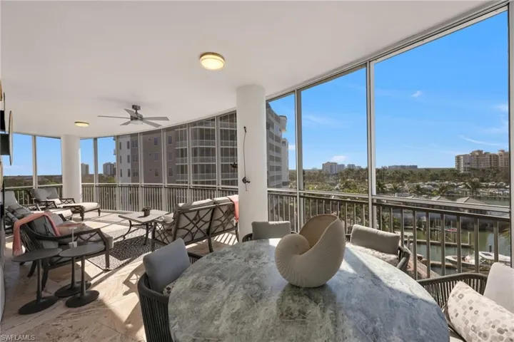 Spacious lanai with dining and seating areas provides outdoor living and endless views