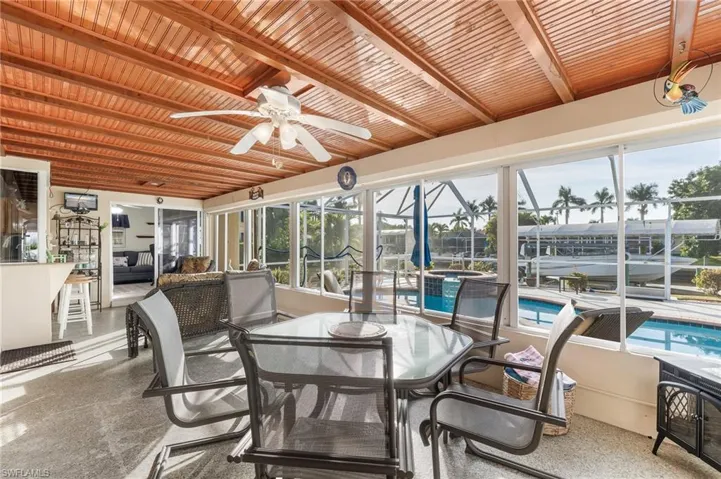 Large Screened Lanai with Two sliders And A Pass Through From The Kitchen