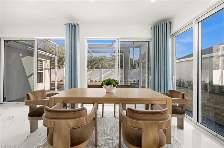 Dining room featuring marble finish floors
