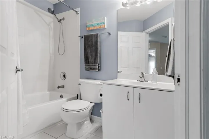 Upstairs guest bathroom features tub/shower combo.