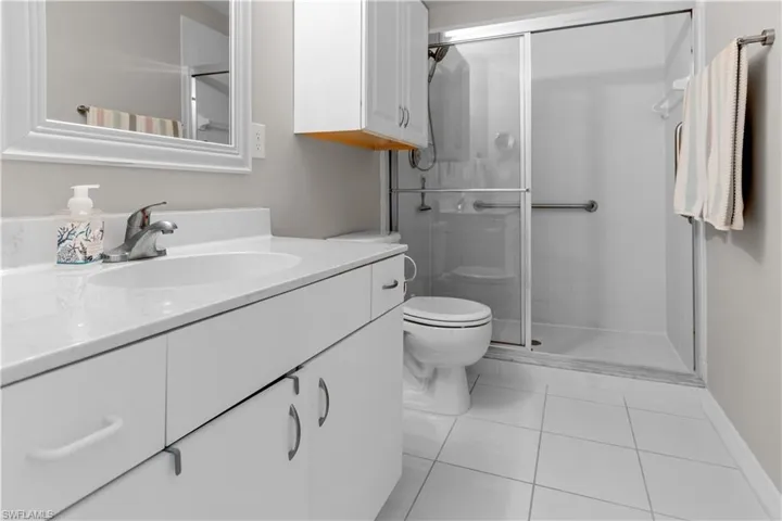 Your primary bathroom features a walk-in shower
